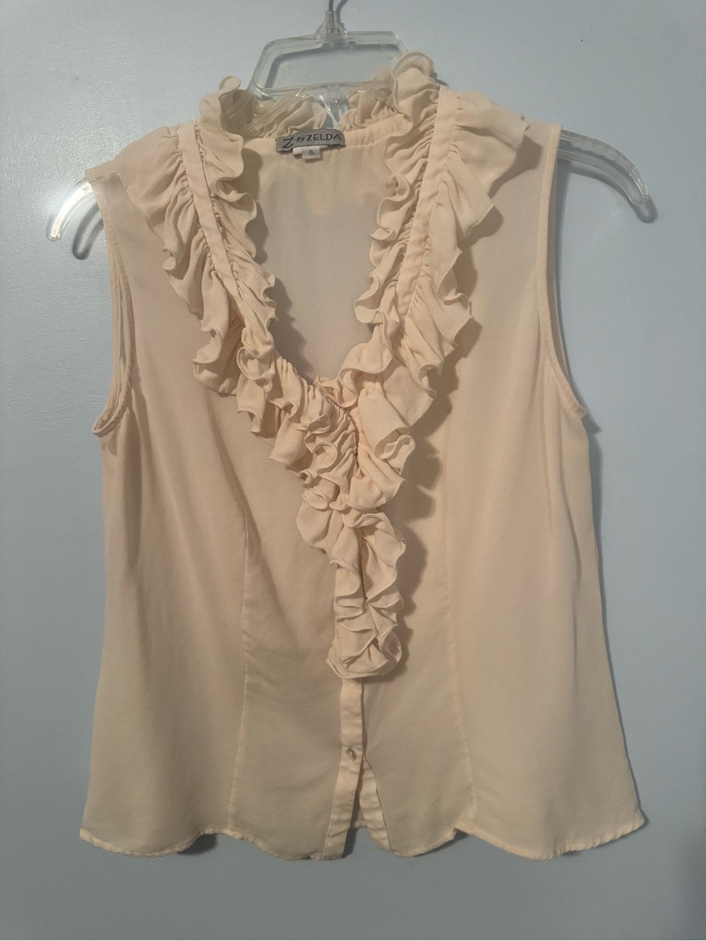 Zelda Cream Ruffle Front Sleeveless Blouse